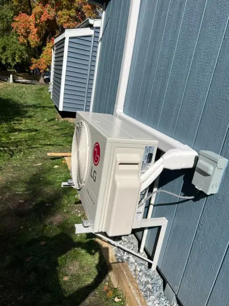 LG ductless mini split outdoor unit mounted on house exterior in Elkridge MD residential HVAC cooling system
